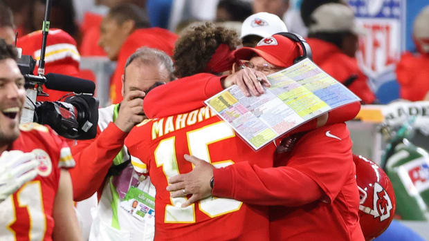 Feb 2, 2020; Miami Gardens, Florida, USA; Kansas City Chiefs quarterback Patrick Mahomes (15) hugs Chiefs head coach Andy Reid (R) on the sidelines against the San Francisco 49ers in the fourth quarter in Super Bowl LIV at Hard Rock Stadium. Mandatory Credit: Geoff Burke-USA TODAY Sports